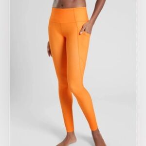 Athleta Salutation Stash Leggings with Pockets Sunrise Orange